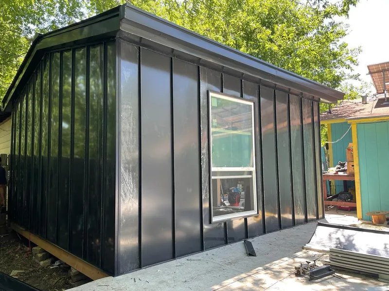 Black standing seam metal wall panels for Roof Inspection in Mason City