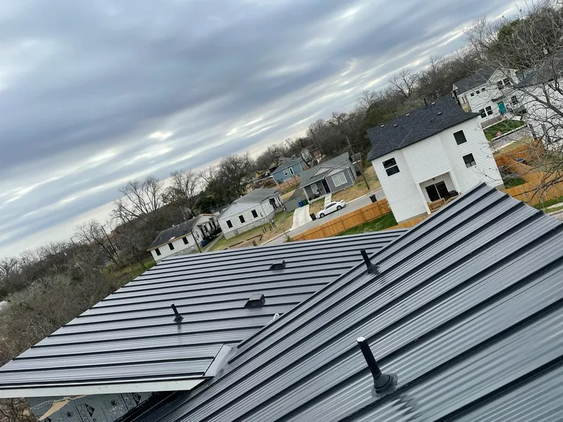 Standing seam metal roof panels with vents for Skylight Repair in Mason City
